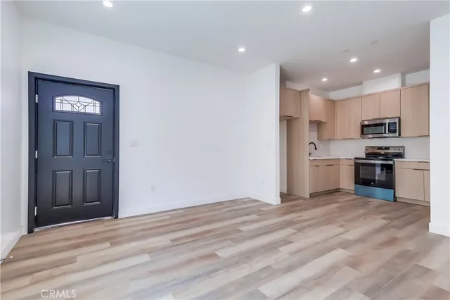 a view of kitchen with wooden floor