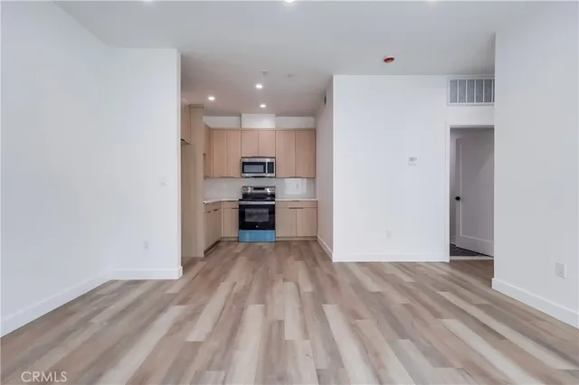 a view of kitchen with wooden floor