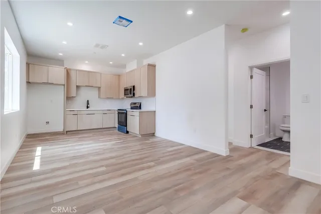 a view of kitchen with wooden floor