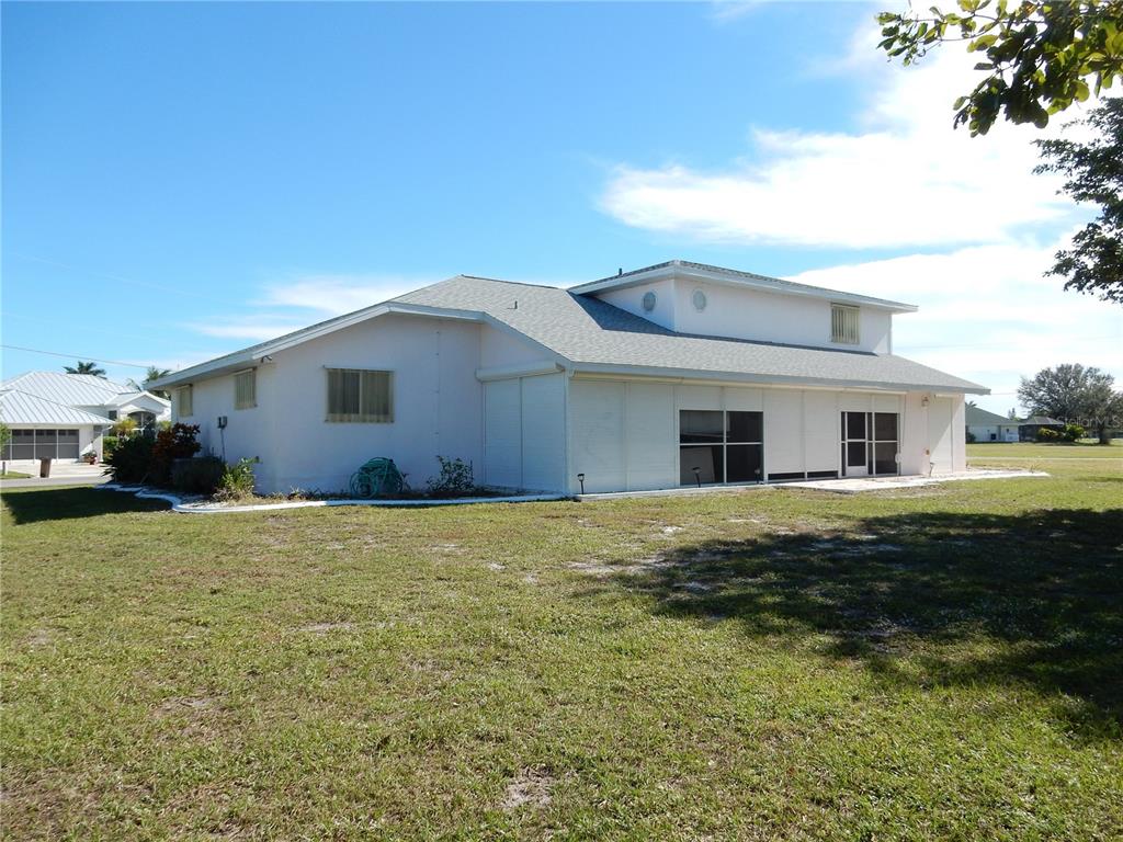 7321 Powder Puff Punta Gorda, FL 33955 - Photo 6 of 31 Rear View. Notice the roll down shutters!
