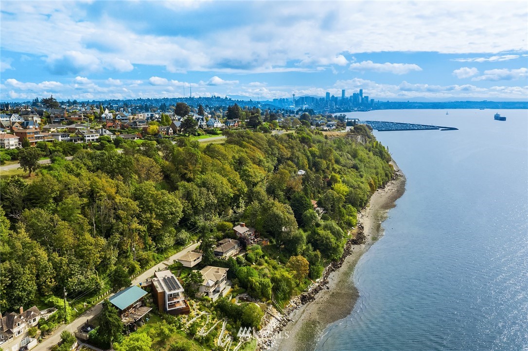 2318 Perkins Lane West Seattle, WA 98199 - Photo 5 of 8 a view of a lake with a city