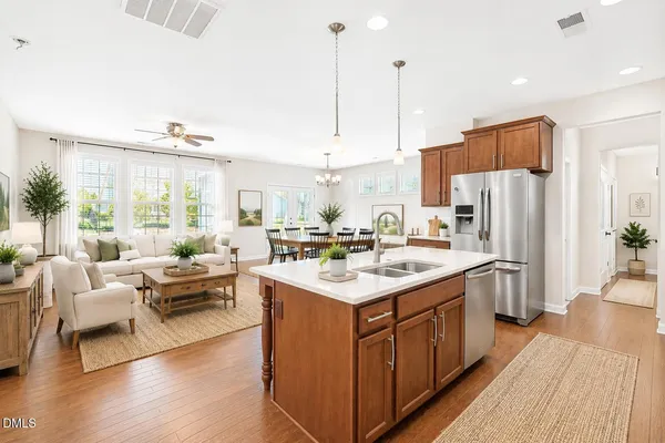 a kitchen with a sink a counter top space and stainless steel appliances