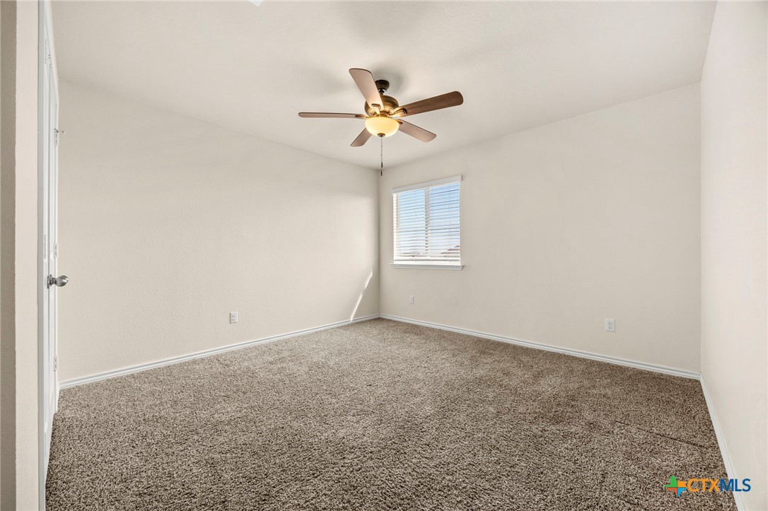 5927 Galveston Road Belton, TX 76513 - Photo 36 of 39 an empty room with windows and fan