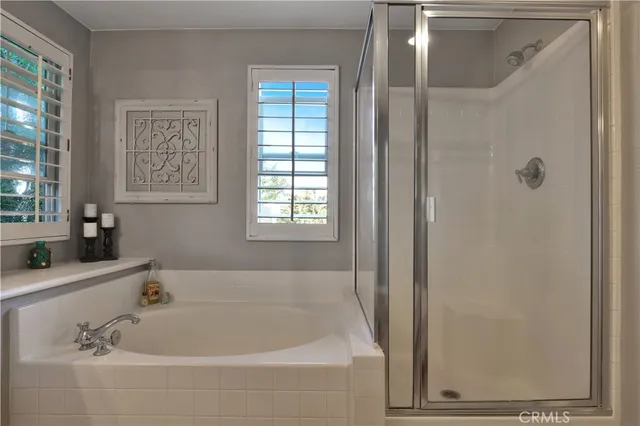 a white bath tub sitting next to a window