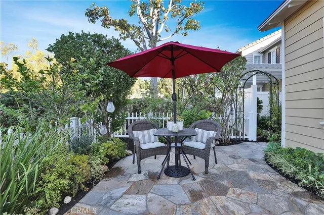 a patio with a patio table and chairs