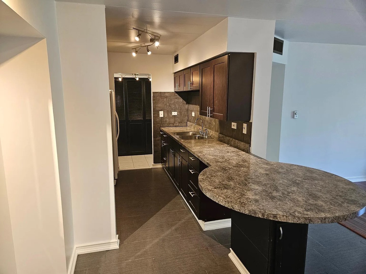 300 South Roselle Road, Unit 111 Schaumburg, IL 60193 - Photo 3 of 13 a bathroom with a granite countertop sink and a mirror