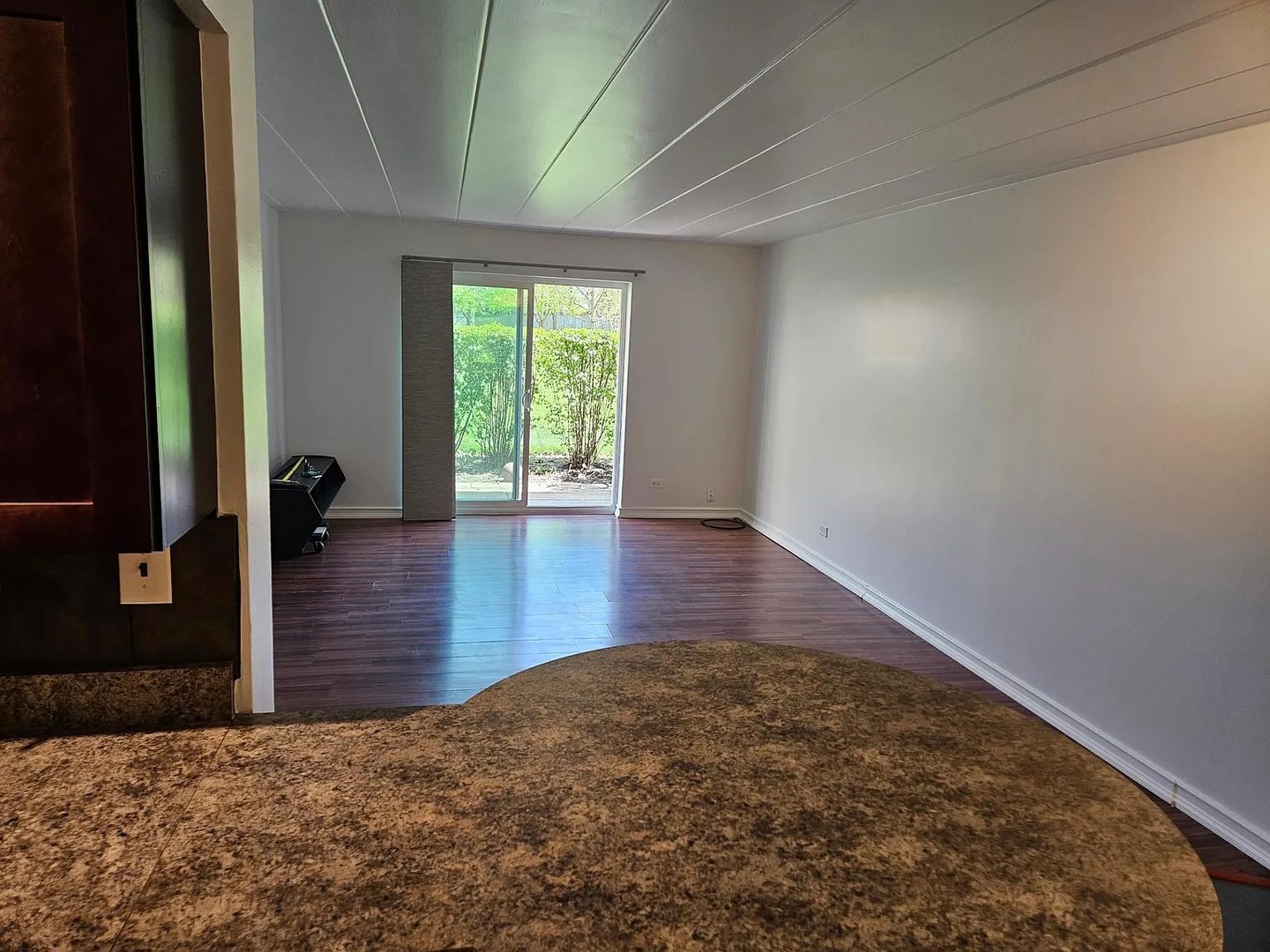 300 South Roselle Road, Unit 111 Schaumburg, IL 60193 - Photo 5 of 13 a view of empty room with wooden floor and fan