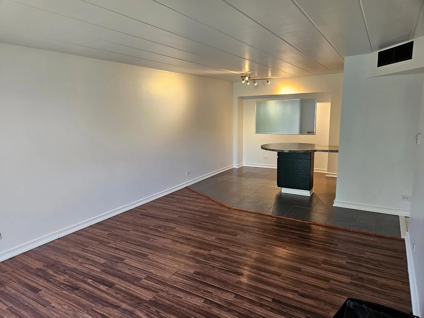 300 South Roselle Road, Unit 111 Schaumburg, IL 60193 - Photo 6 of 13 a view of room with wooden floor and staircase