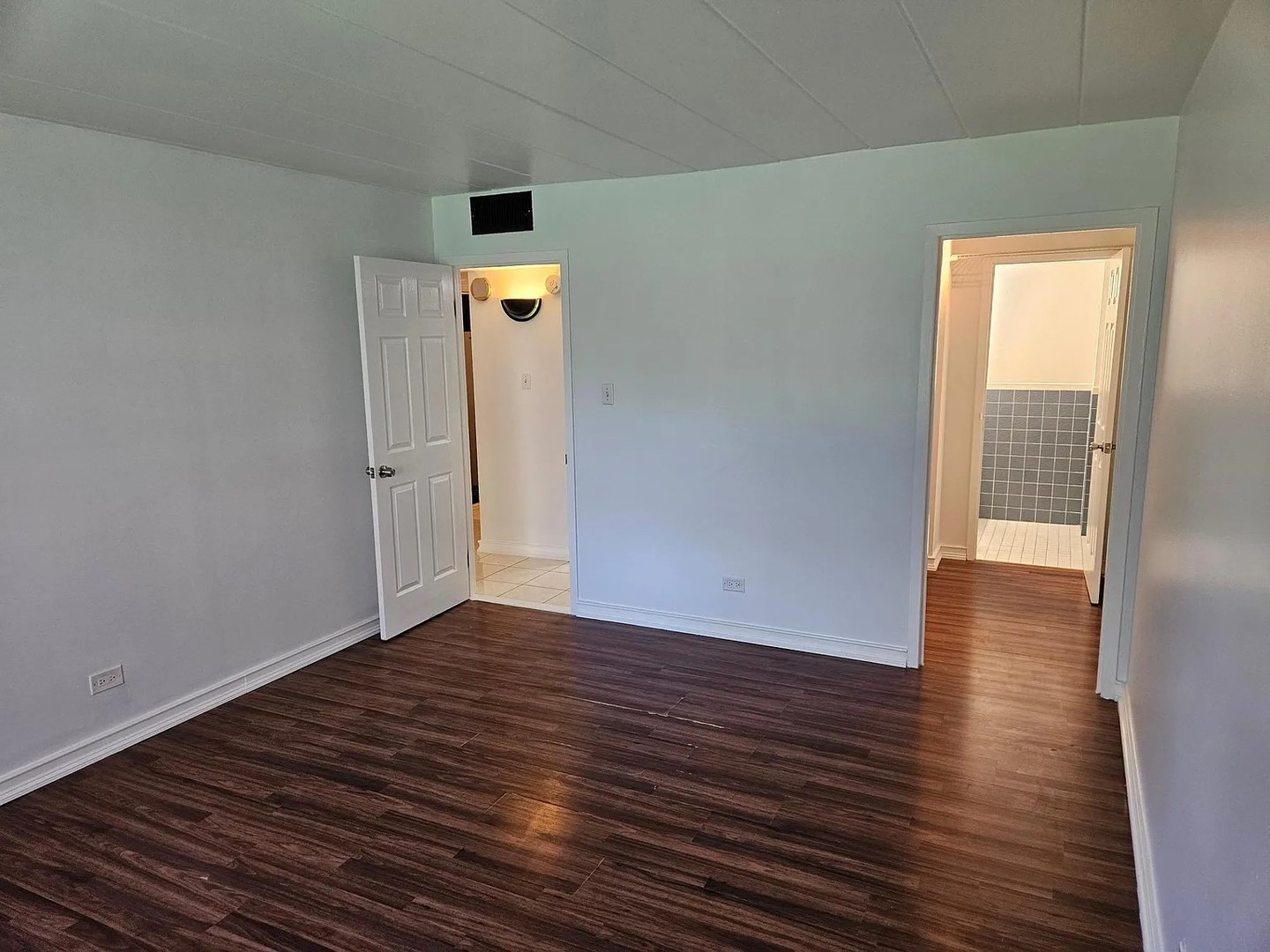 300 South Roselle Road, Unit 111 Schaumburg, IL 60193 - Photo 7 of 13 wooden floor in an empty room