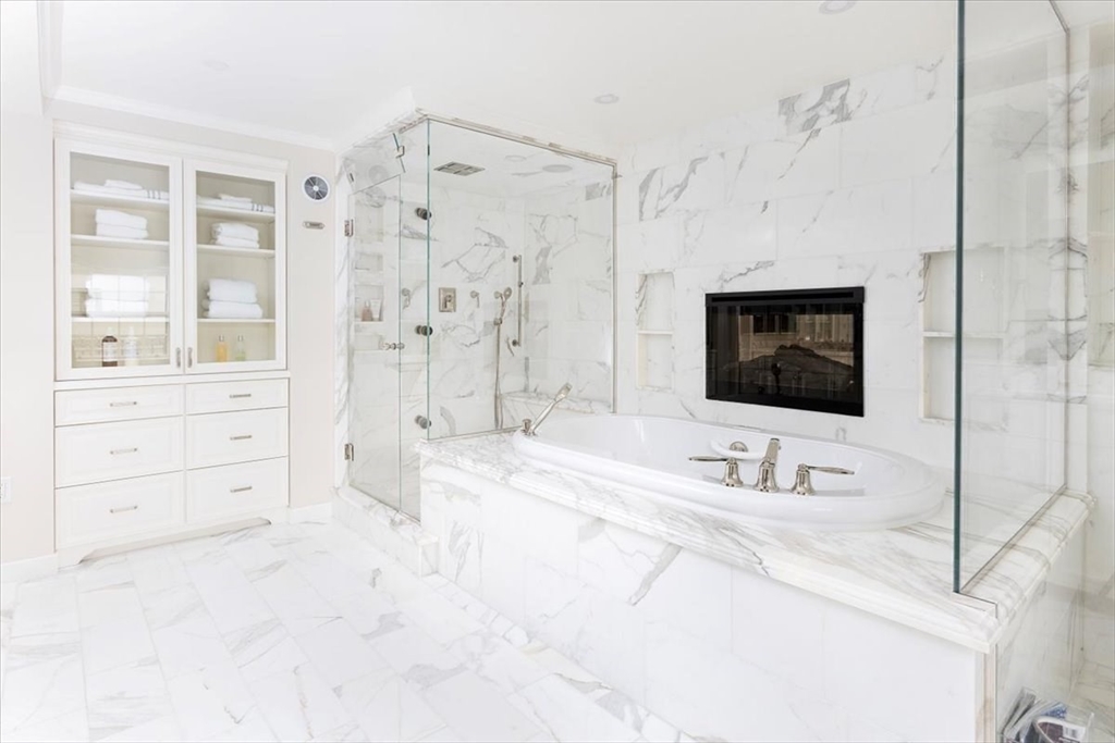 142 Chestnut Street, Unit 89 Boston, MA 02108 - Photo 12 of 16 a bathroom with a sink a mirror and a shower