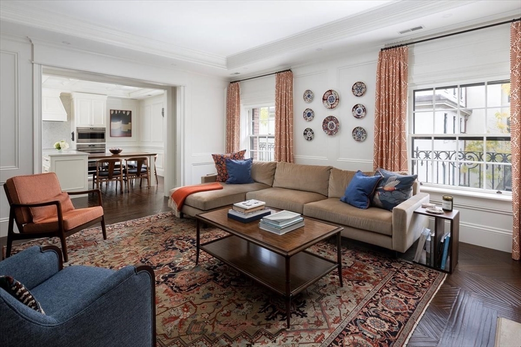 142 Chestnut Street, Unit 89 Boston, MA 02108 - Photo 3 of 16 a living room with furniture and wooden floor
