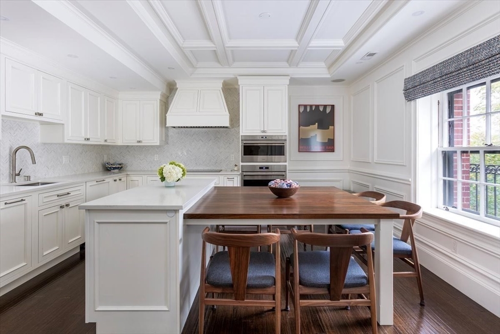 142 Chestnut Street, Unit 89 Boston, MA 02108 - Photo 4 of 16 a kitchen with a stove a sink and cabinets