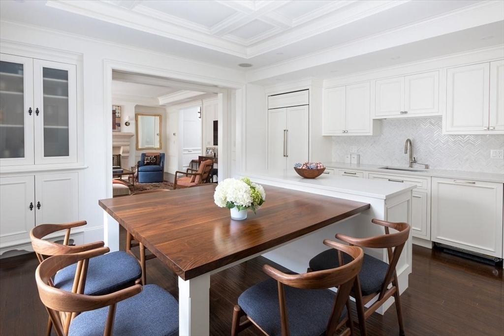 142 Chestnut Street, Unit 89 Boston, MA 02108 - Photo 5 of 16 a view of a dining room with furniture and wooden floor