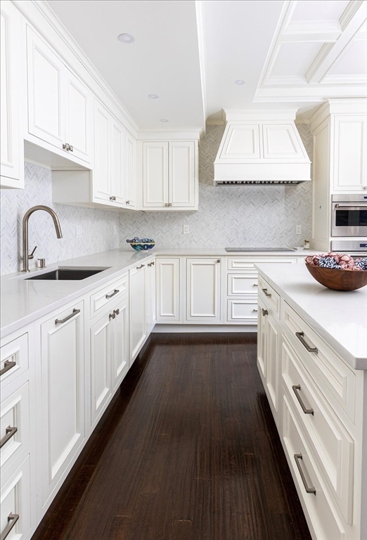 142 Chestnut Street, Unit 89 Boston, MA 02108 - Photo 6 of 16 a kitchen with kitchen island granite countertop a sink cabinets and stainless steel appliances
