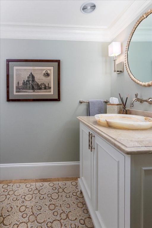 142 Chestnut Street, Unit 89 Boston, MA 02108 - Photo 7 of 16 a bathroom with a granite countertop sink and a mirror