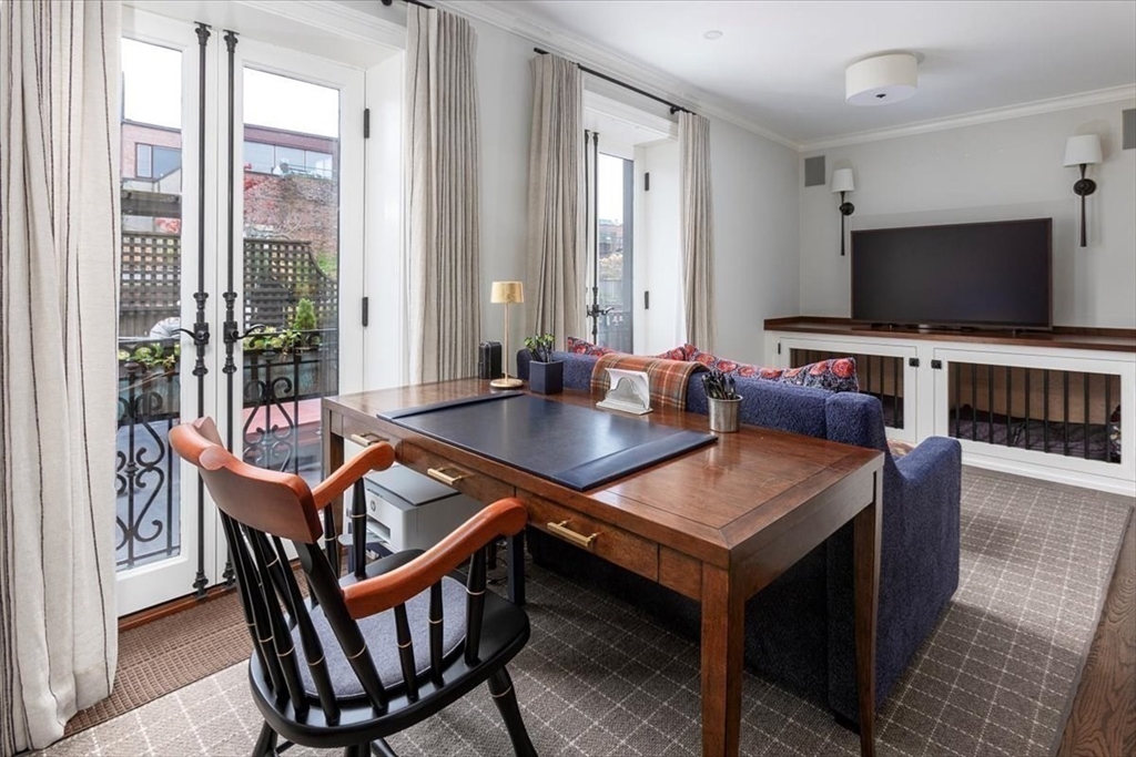 142 Chestnut Street, Unit 89 Boston, MA 02108 - Photo 9 of 16 a view of a dining room with furniture window and wooden floor