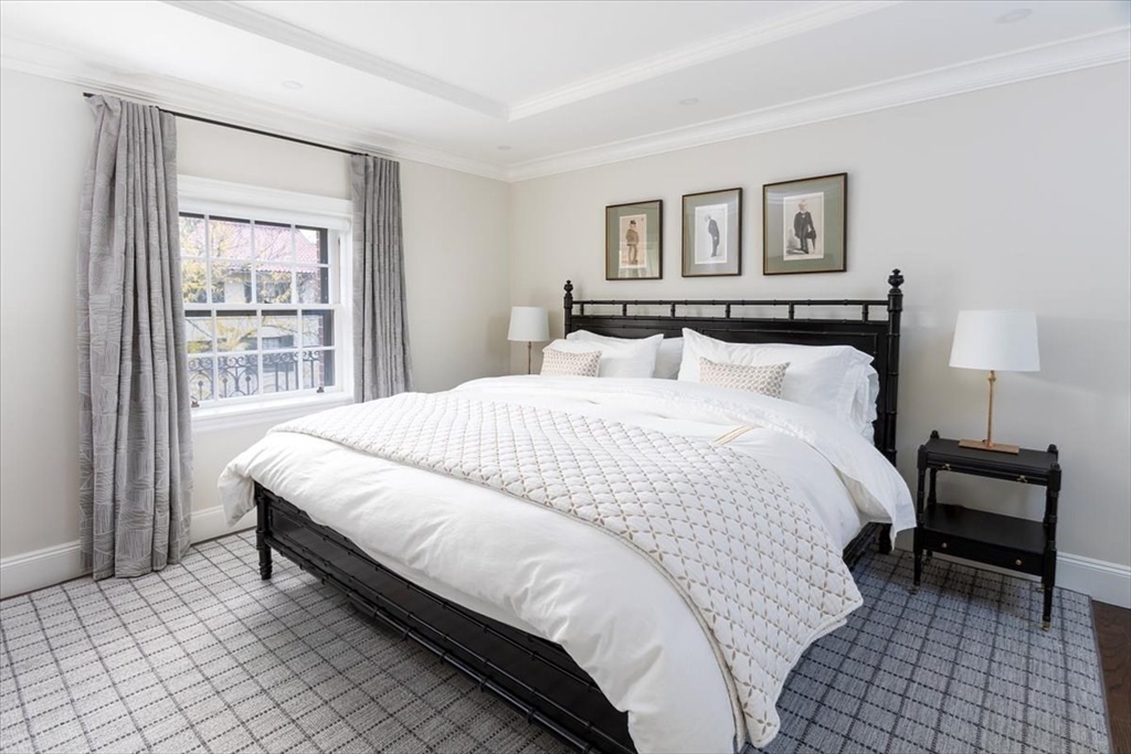 142 Chestnut Street, Unit 89 Boston, MA 02108 - Photo 10 of 16 a bedroom with a bed and a night stand