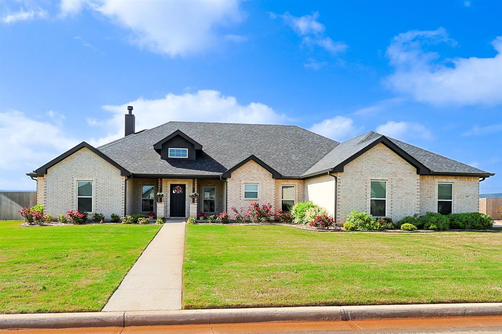 107 Kleingrass Road Abilene, TX 79606 - Photo 29 of 33 Brick exterior home featuring a dark gray shingle roof and a front entry