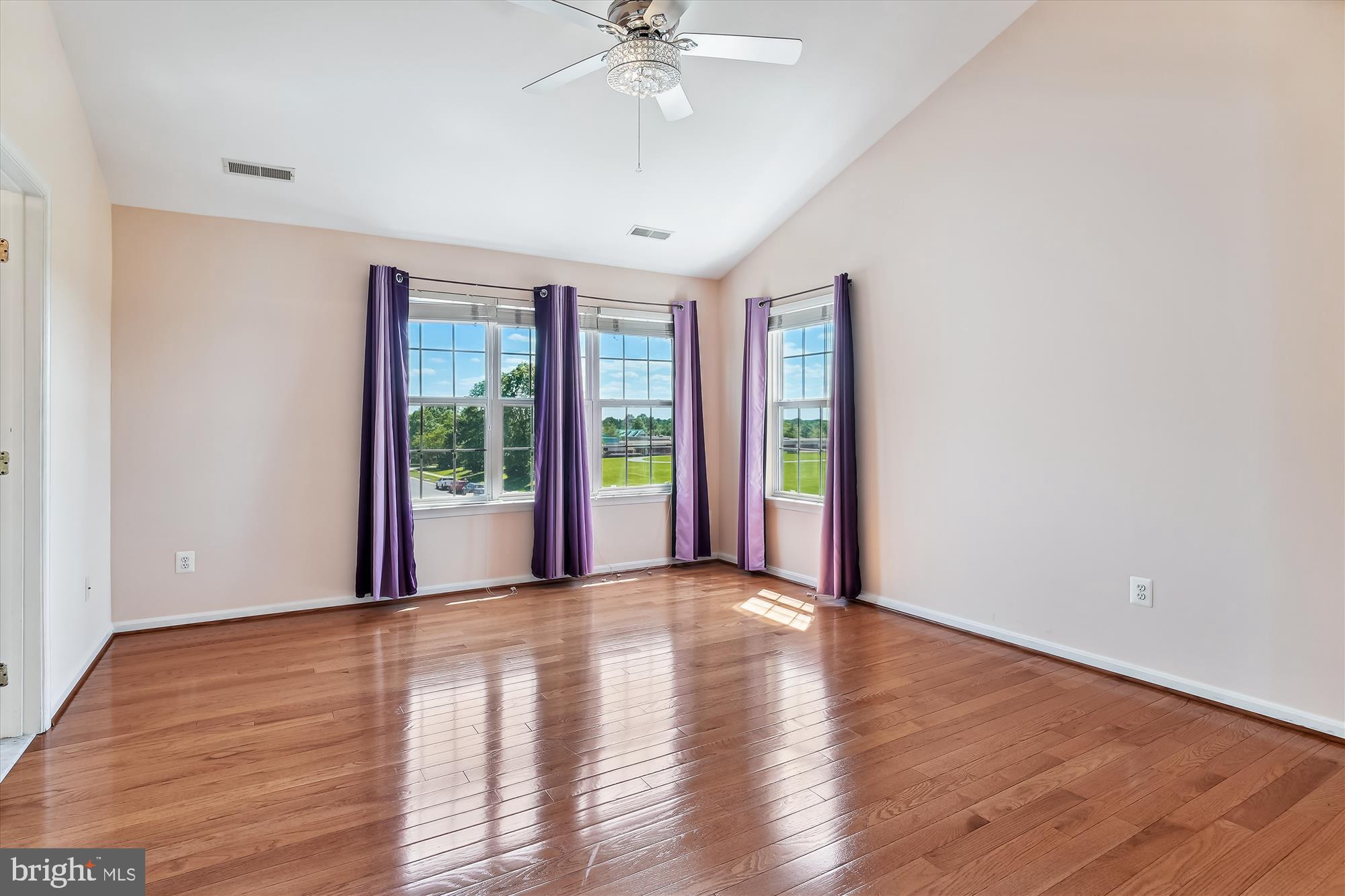 43536 Gabriel Square Chantilly, VA 20152 - Photo 12 of 53 a view of an empty room with a window and wooden floor