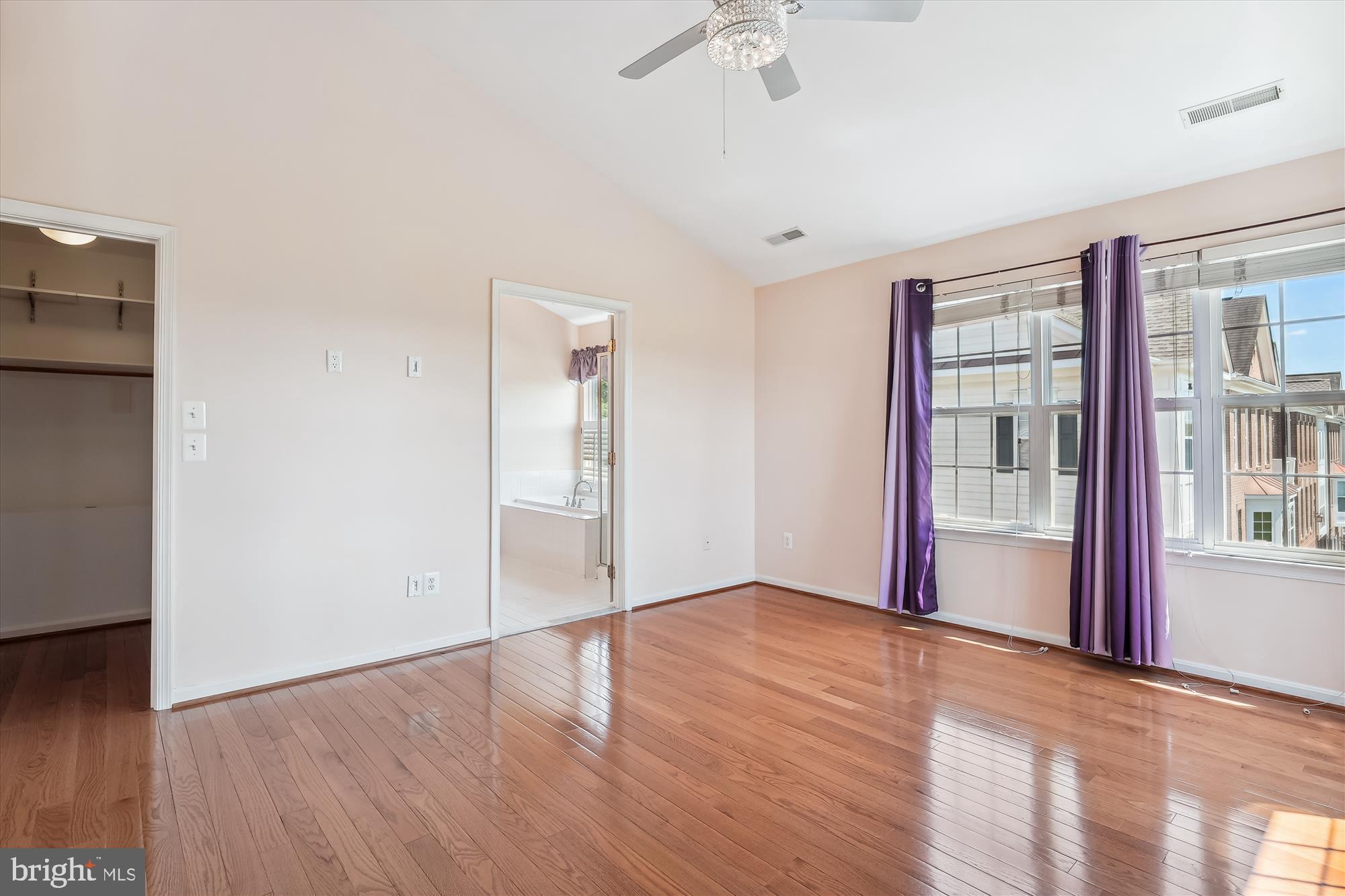 43536 Gabriel Square Chantilly, VA 20152 - Photo 13 of 53 a view of an empty room with wooden floor and a window