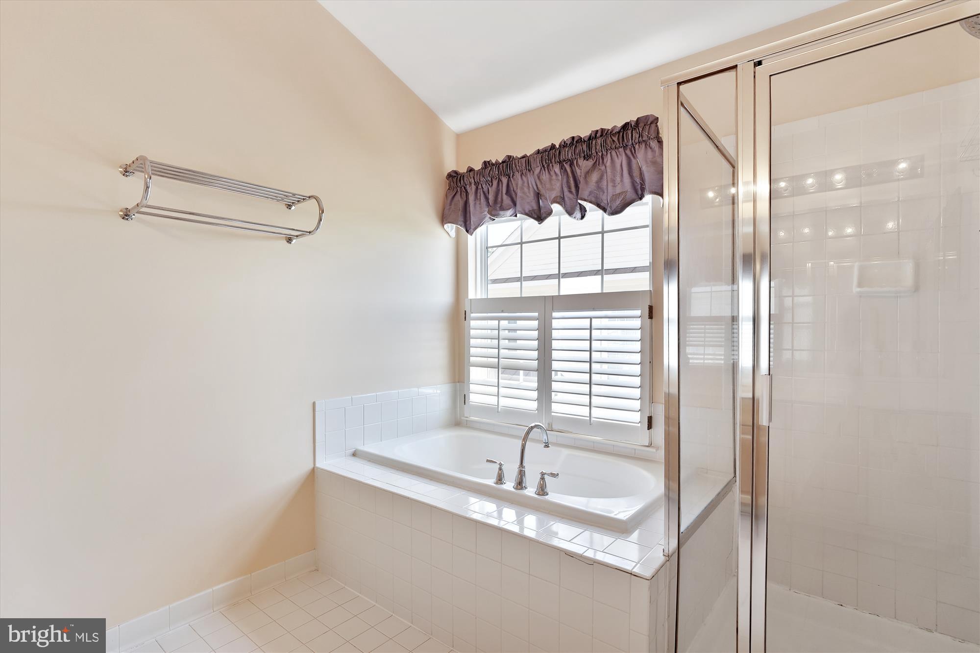 43536 Gabriel Square Chantilly, VA 20152 - Photo 16 of 53 a bathroom with a granite countertop sink a mirror and a shower