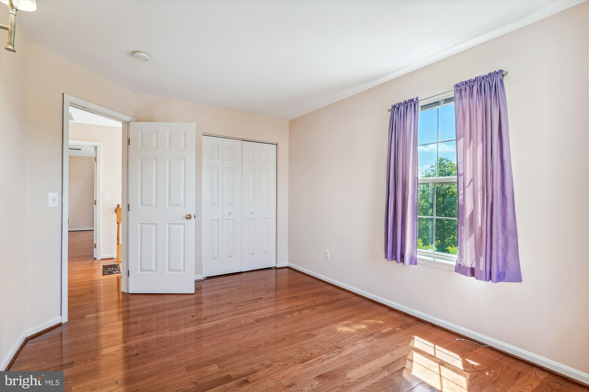 43536 Gabriel Square Chantilly, VA 20152 - Photo 19 of 53 a view of an empty room with wooden floor and a window