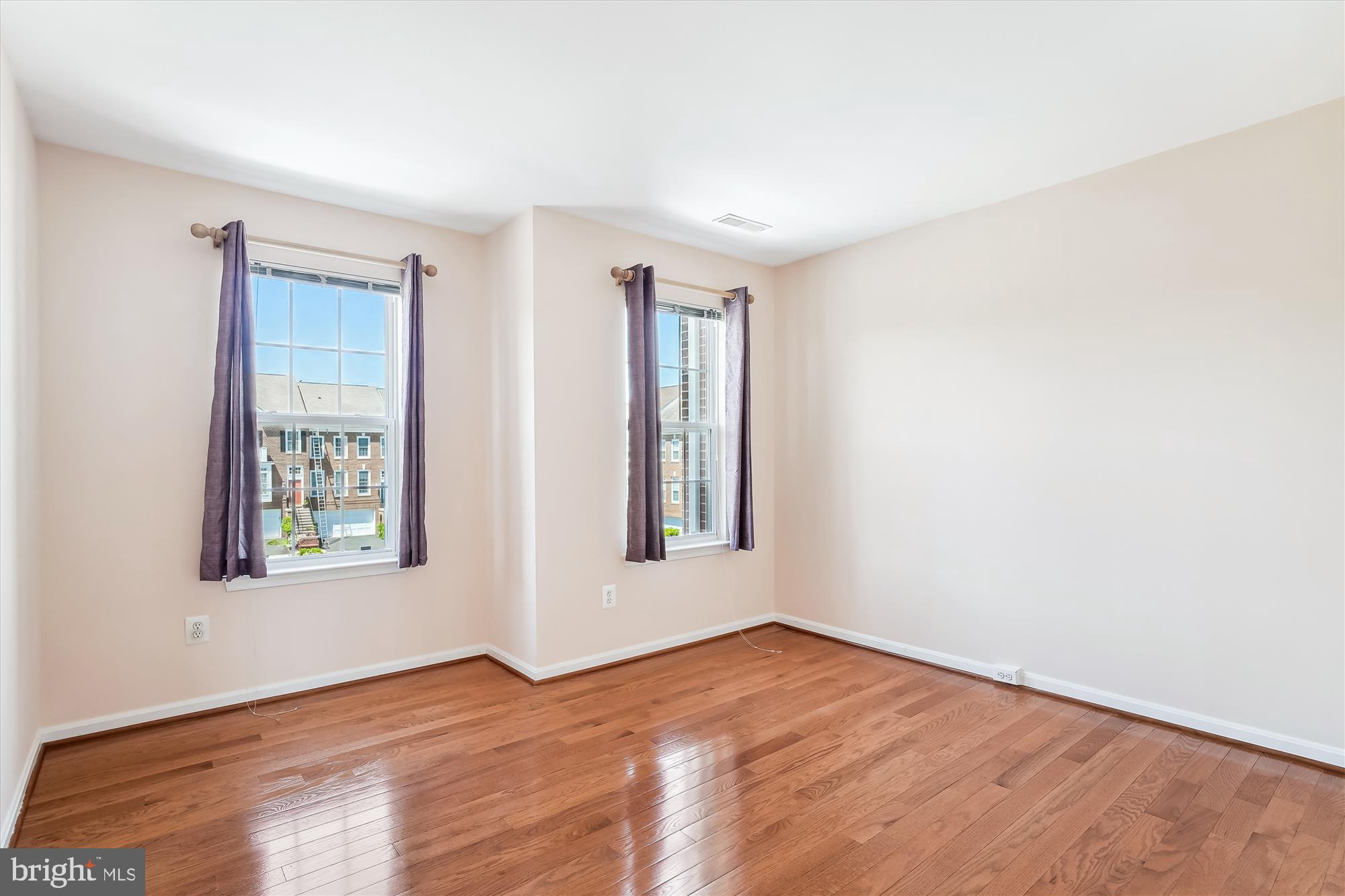 43536 Gabriel Square Chantilly, VA 20152 - Photo 20 of 53 an empty room with wooden floor and windows