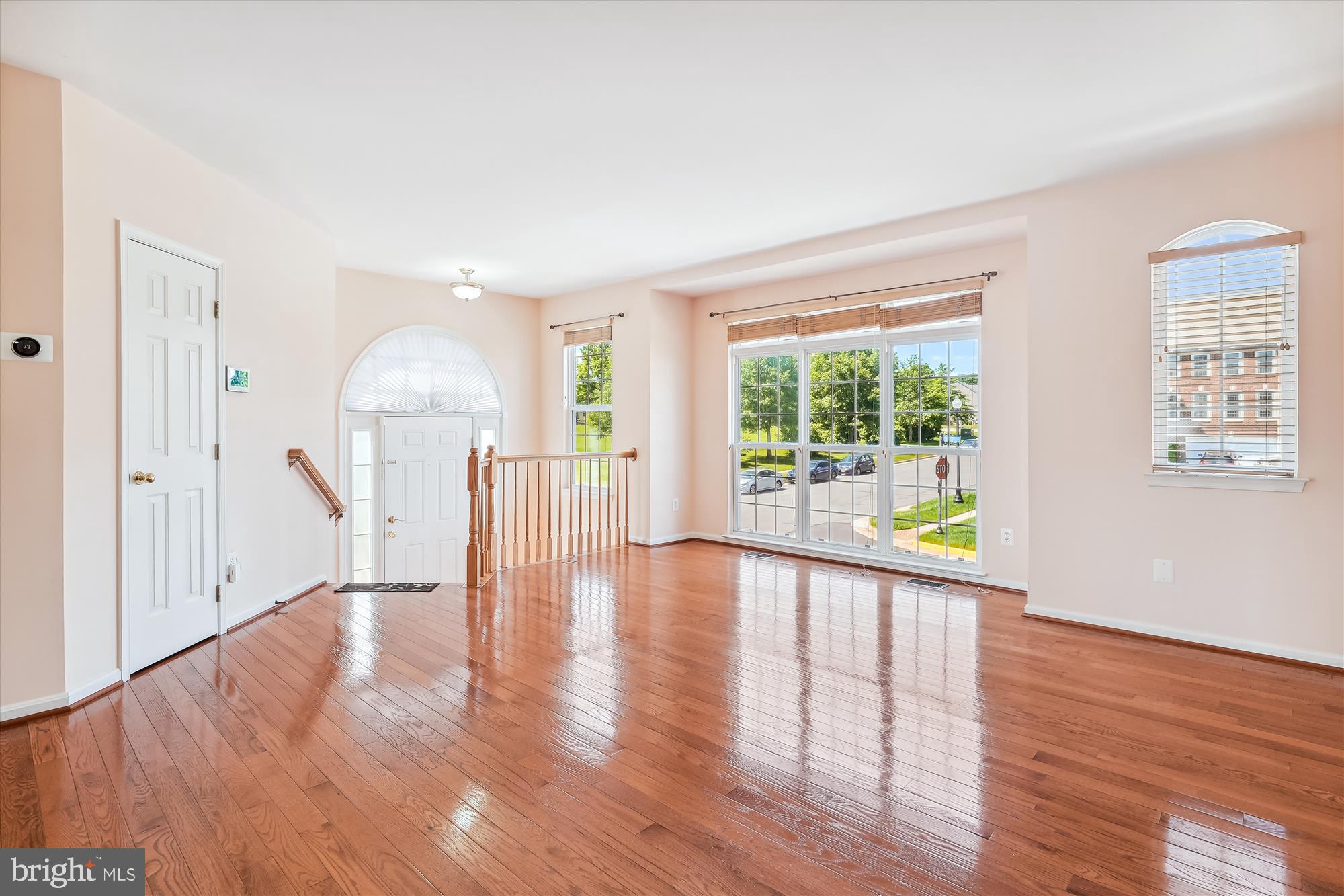 43536 Gabriel Square Chantilly, VA 20152 - Photo 2 of 53 a view of an empty room with wooden floor and a window