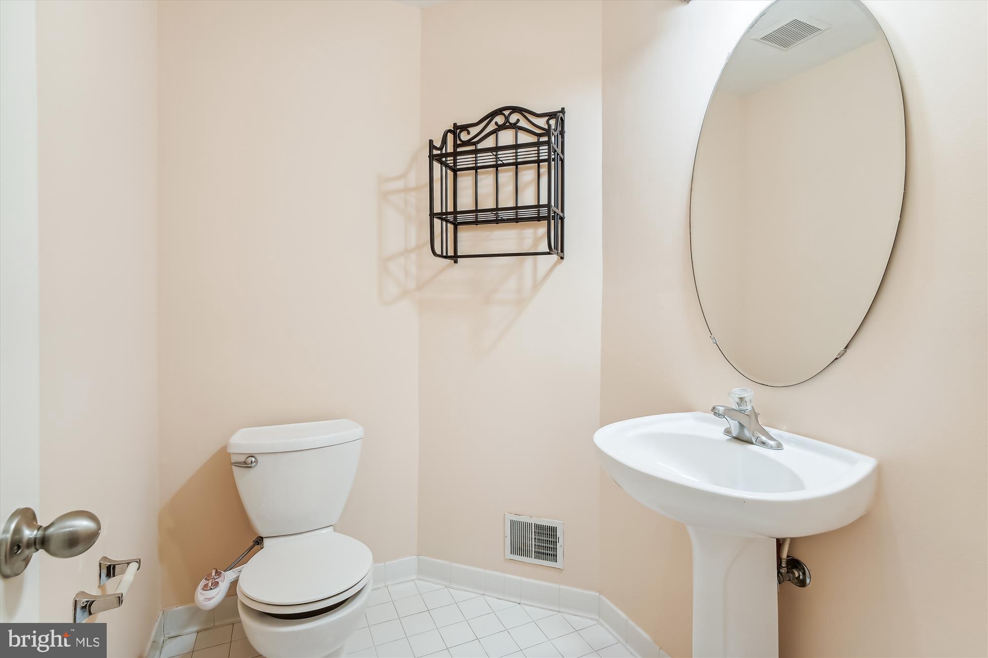 43536 Gabriel Square Chantilly, VA 20152 - Photo 24 of 53 a bathroom with a toilet sink and mirror