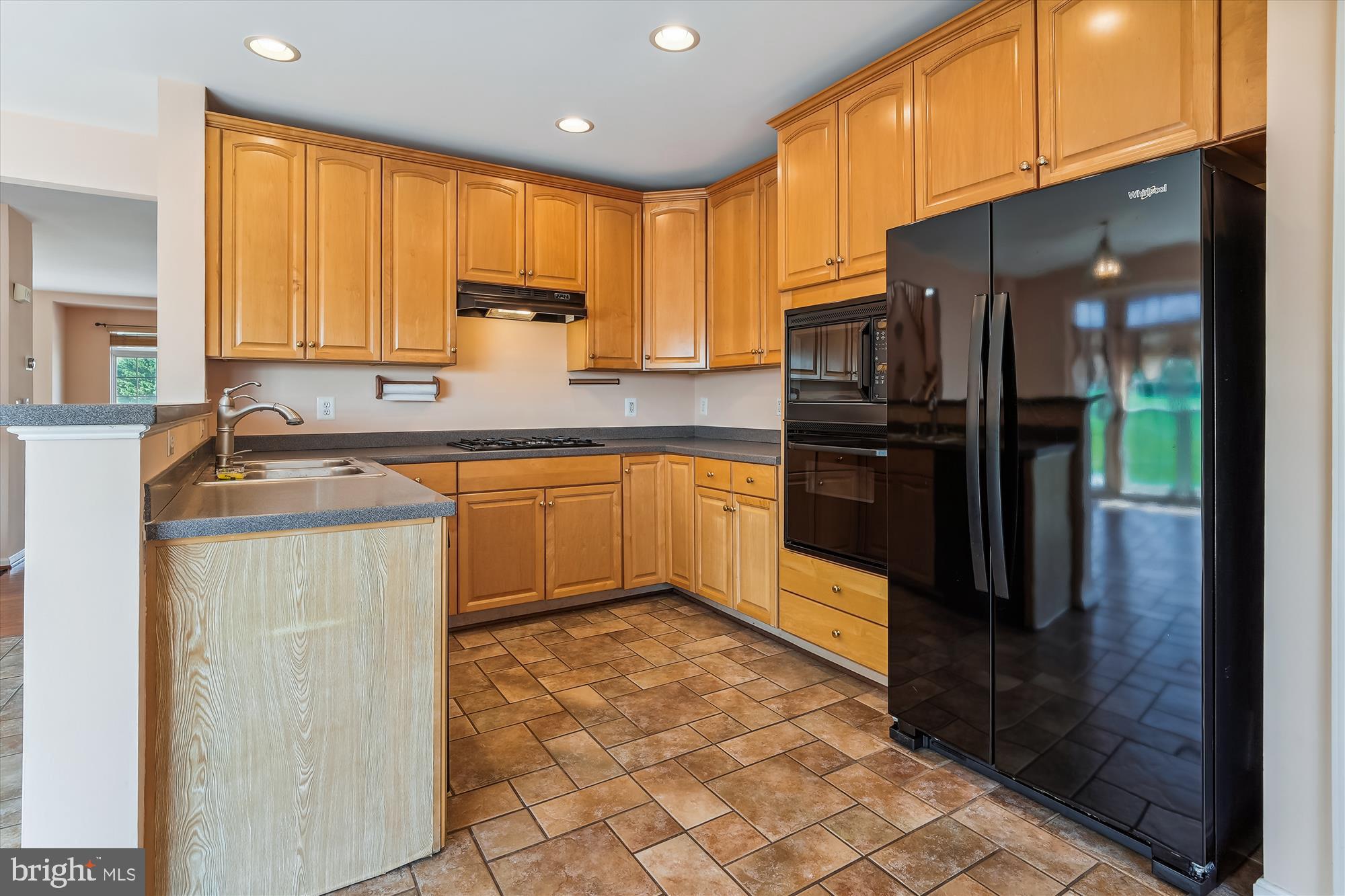 43536 Gabriel Square Chantilly, VA 20152 - Photo 8 of 53 a kitchen with stainless steel appliances granite countertop a stove a sink dishwasher and a refrigerator