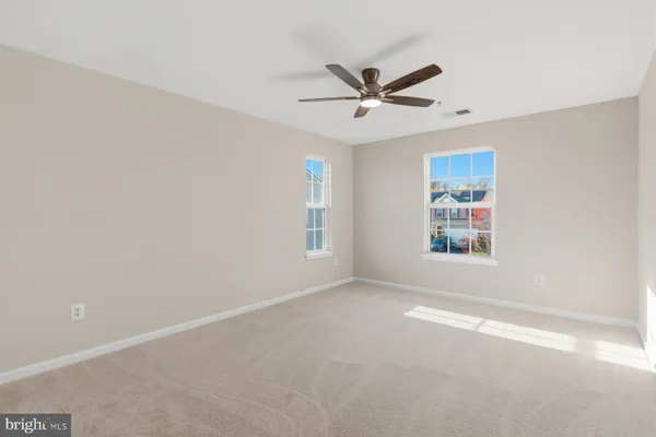 a view of a big room with carpet