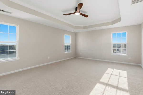 a view of empty room with windows
