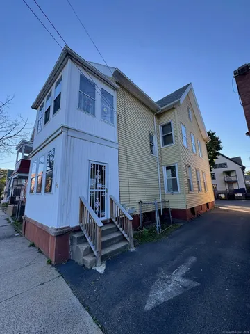 a house view with a sitting space and a street