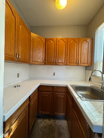 a kitchen with a sink and cabinets