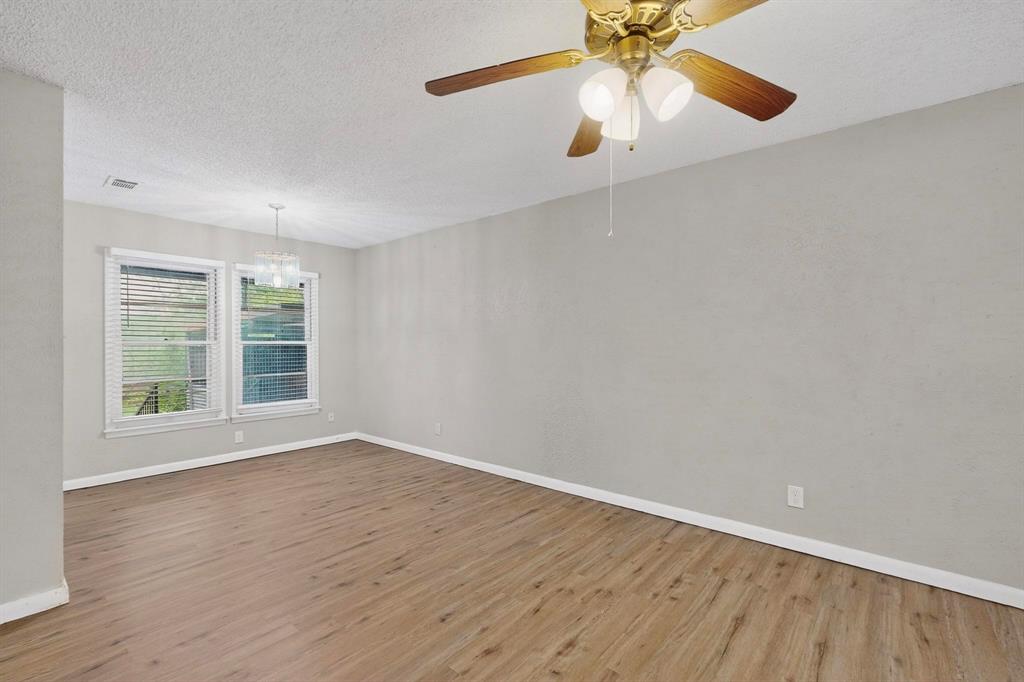 4508 Rutland Avenue Fort Worth, TX 76133 - Photo 9 of 36 wooden floor in an empty room with a window