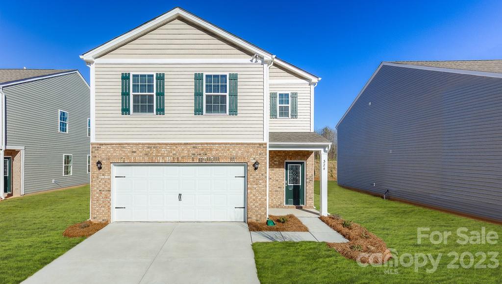 4115 Village Boulevard Northwest Conover, NC 28613 - Photo 1 of 22 a front view of a house with garden