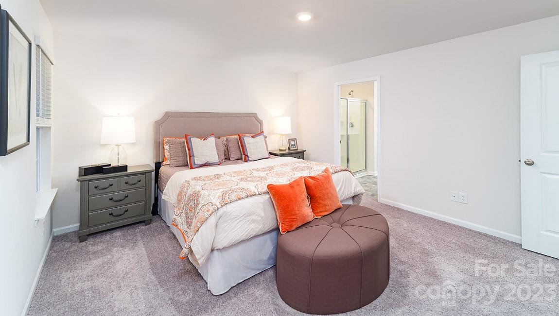 4115 Village Boulevard Northwest Conover, NC 28613 - Photo 12 of 22 a bedroom with a bed and a couch