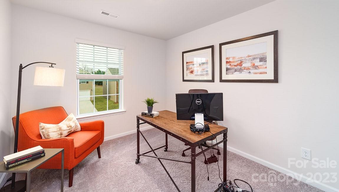 4115 Village Boulevard Northwest Conover, NC 28613 - Photo 16 of 22 a workspace with furniture and a window