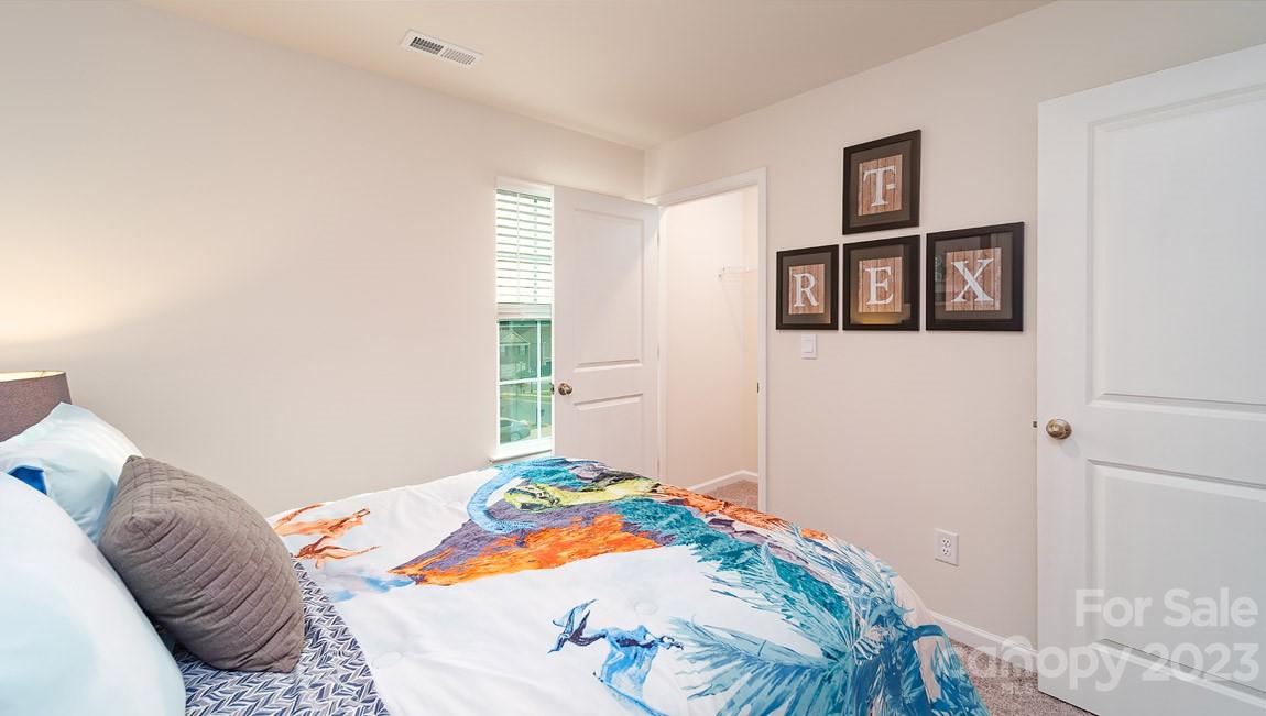 4115 Village Boulevard Northwest Conover, NC 28613 - Photo 19 of 22 a bedroom with a bed and a window