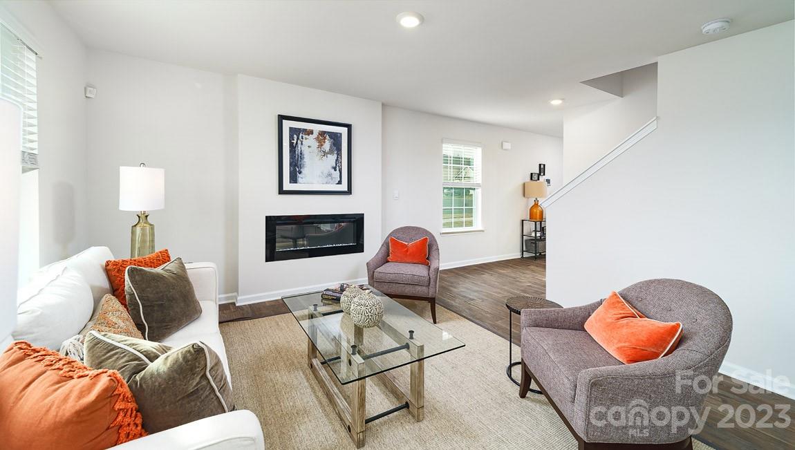 4115 Village Boulevard Northwest Conover, NC 28613 - Photo 5 of 22 a living room with furniture and a flat screen tv