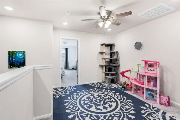 a bedroom with a bed and cabinets