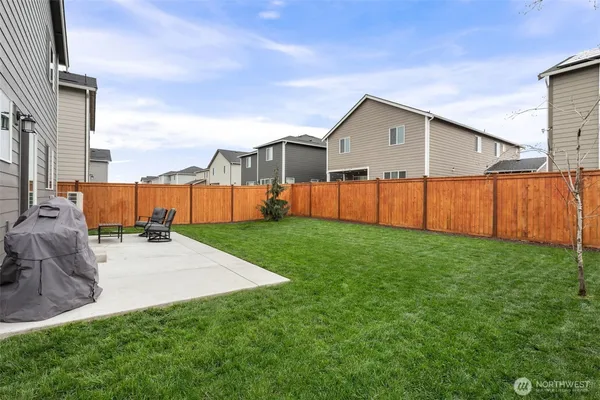 a view of a backyard of the house