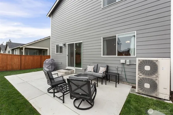 a patio with table and chairs