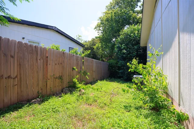 a view of a backyard with potted plants