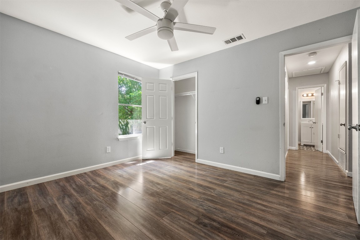 7004 Circle S Road, Unit A Austin, TX 78745 - Photo 6 of 16 a view of an empty room with wooden floor and a window
