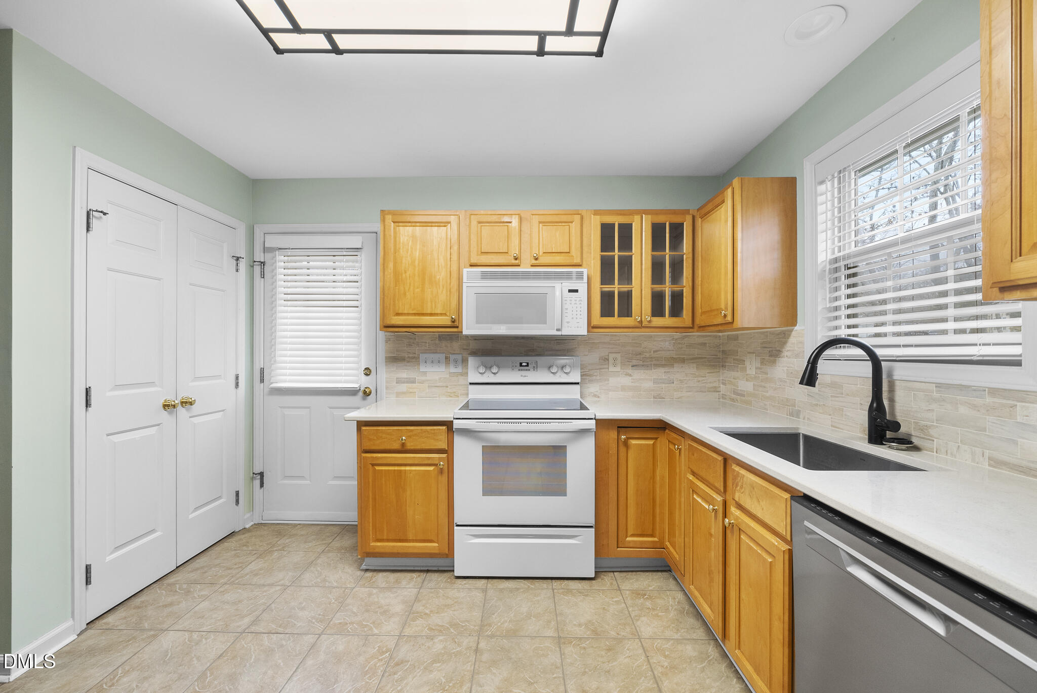 6 Stone Mill Place Durham, NC 27712 - Photo 11 of 44 a kitchen with stainless steel appliances granite countertop a stove and a sink