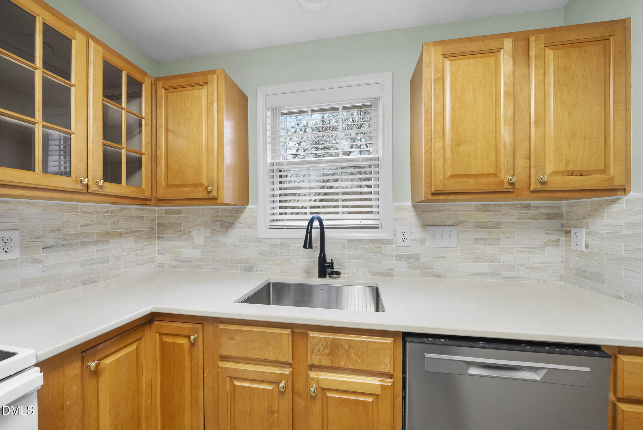 6 Stone Mill Place Durham, NC 27712 - Photo 12 of 44 a kitchen with stainless steel appliances granite countertop a sink and a window