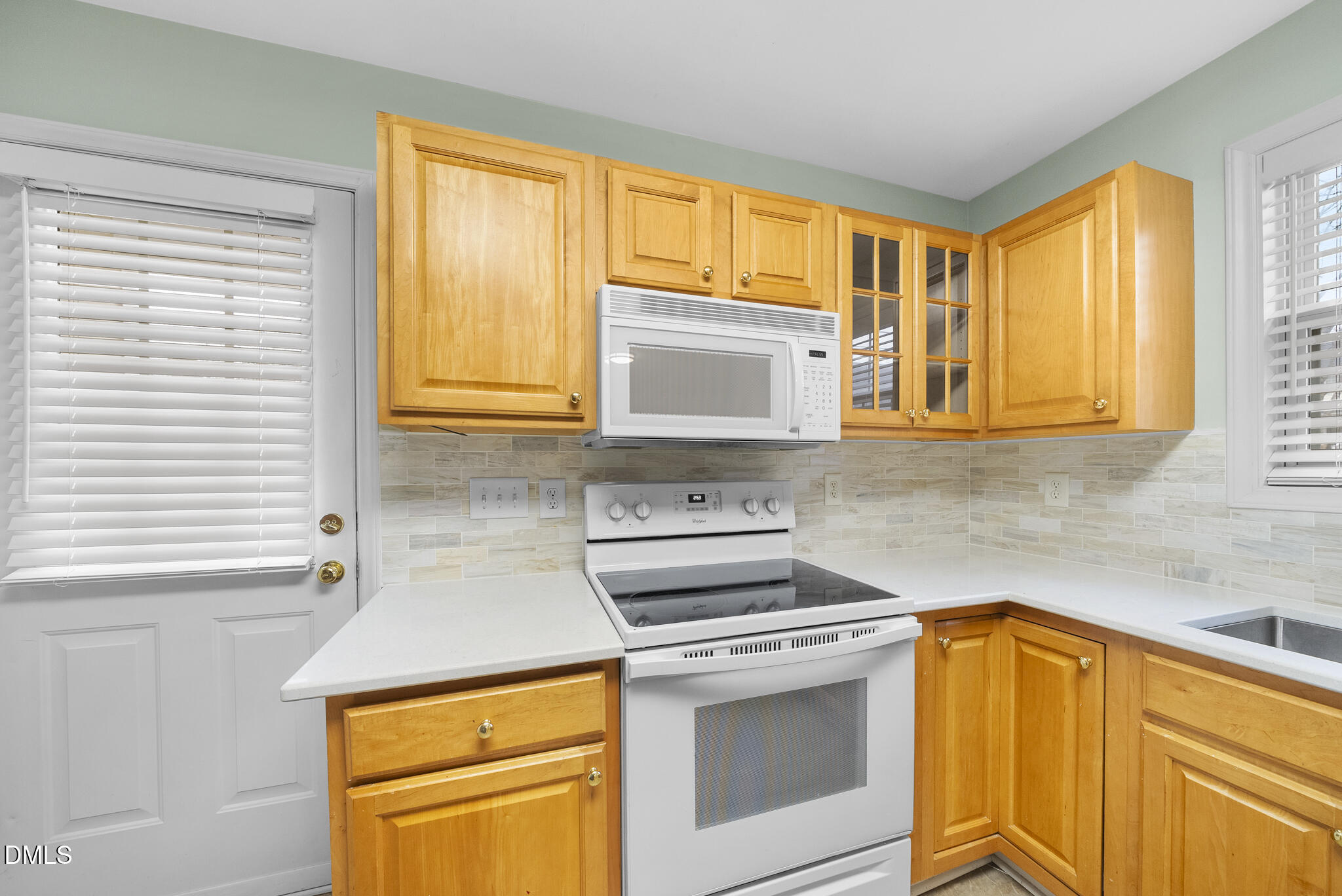6 Stone Mill Place Durham, NC 27712 - Photo 13 of 44 a kitchen with stainless steel appliances a stove sink and cabinets