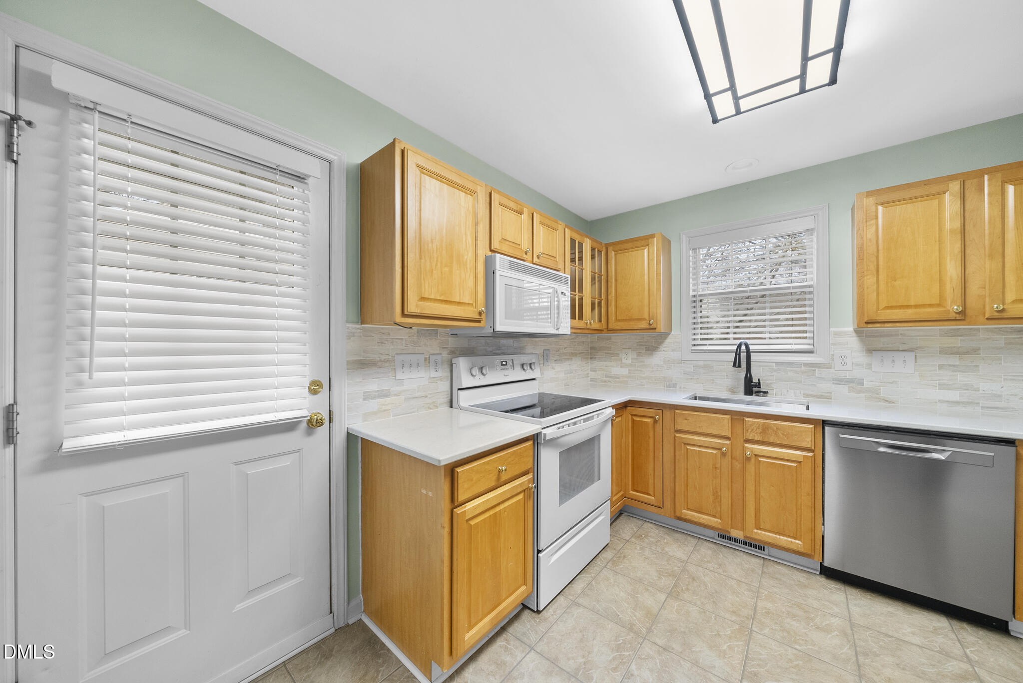 6 Stone Mill Place Durham, NC 27712 - Photo 14 of 44 a kitchen with stainless steel appliances granite countertop a sink stove and cabinets