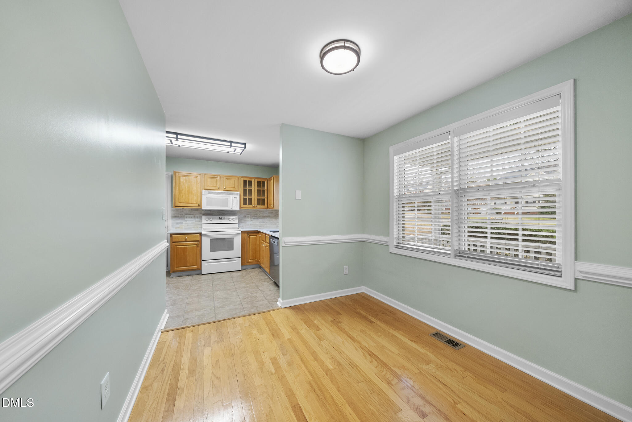 6 Stone Mill Place Durham, NC 27712 - Photo 16 of 44 a view of a room with wooden floor and a window